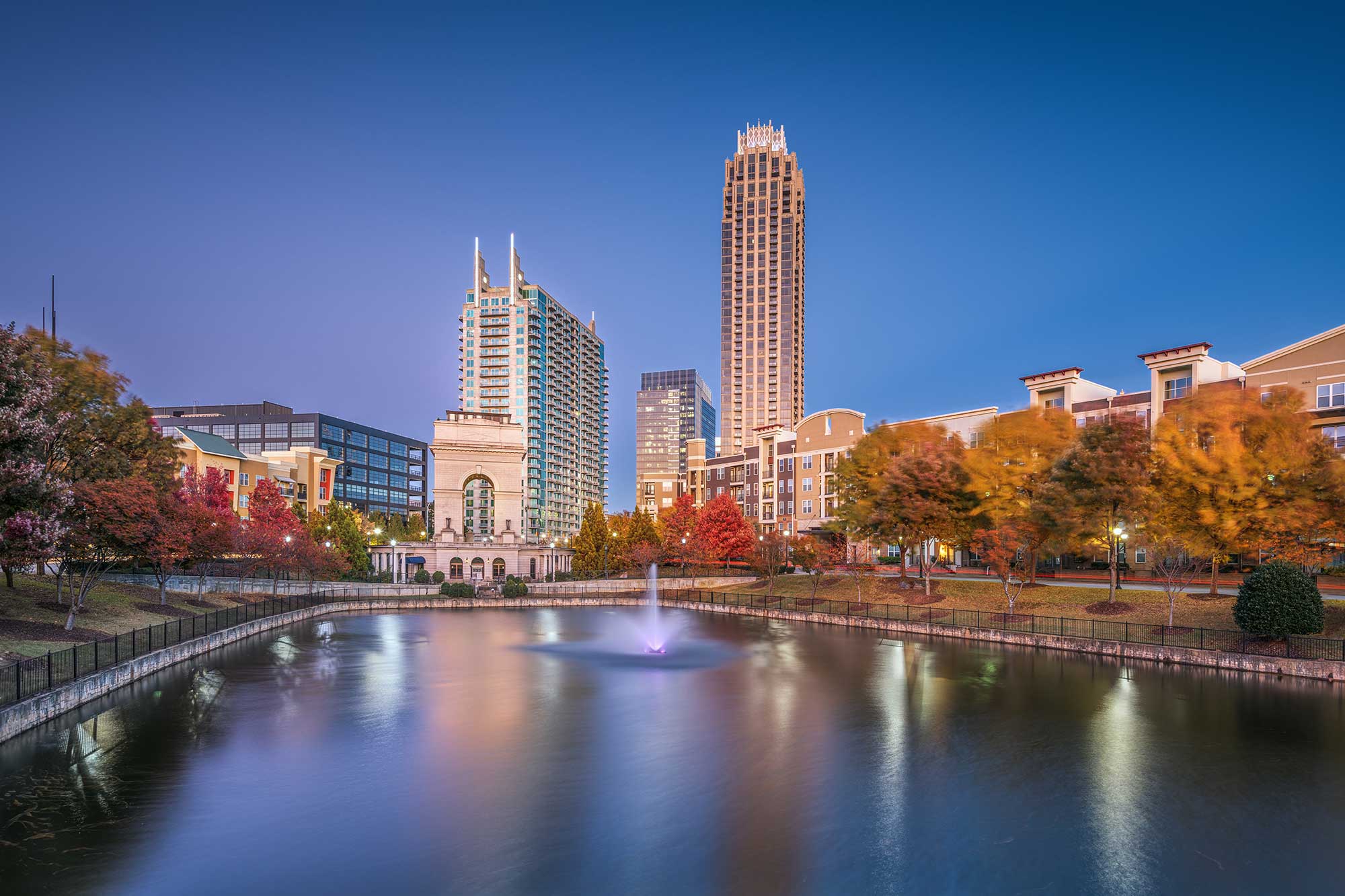 Atlanta, Georgia USA city skyline from Atlantic Station at dusk with Autumn foliage
