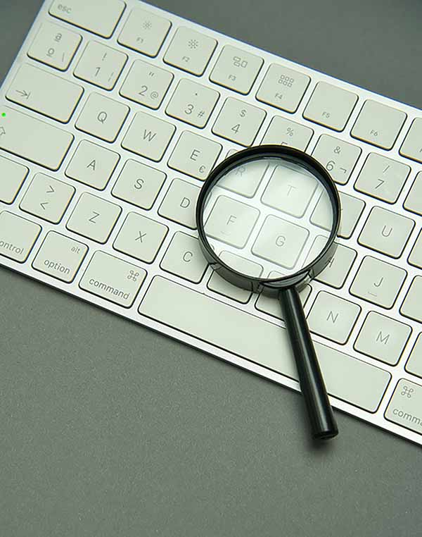 magnifying glass on laptop keyboard