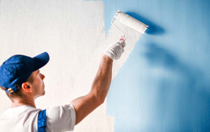Painter painting blue wall white | Allegiant Digital Marketing™