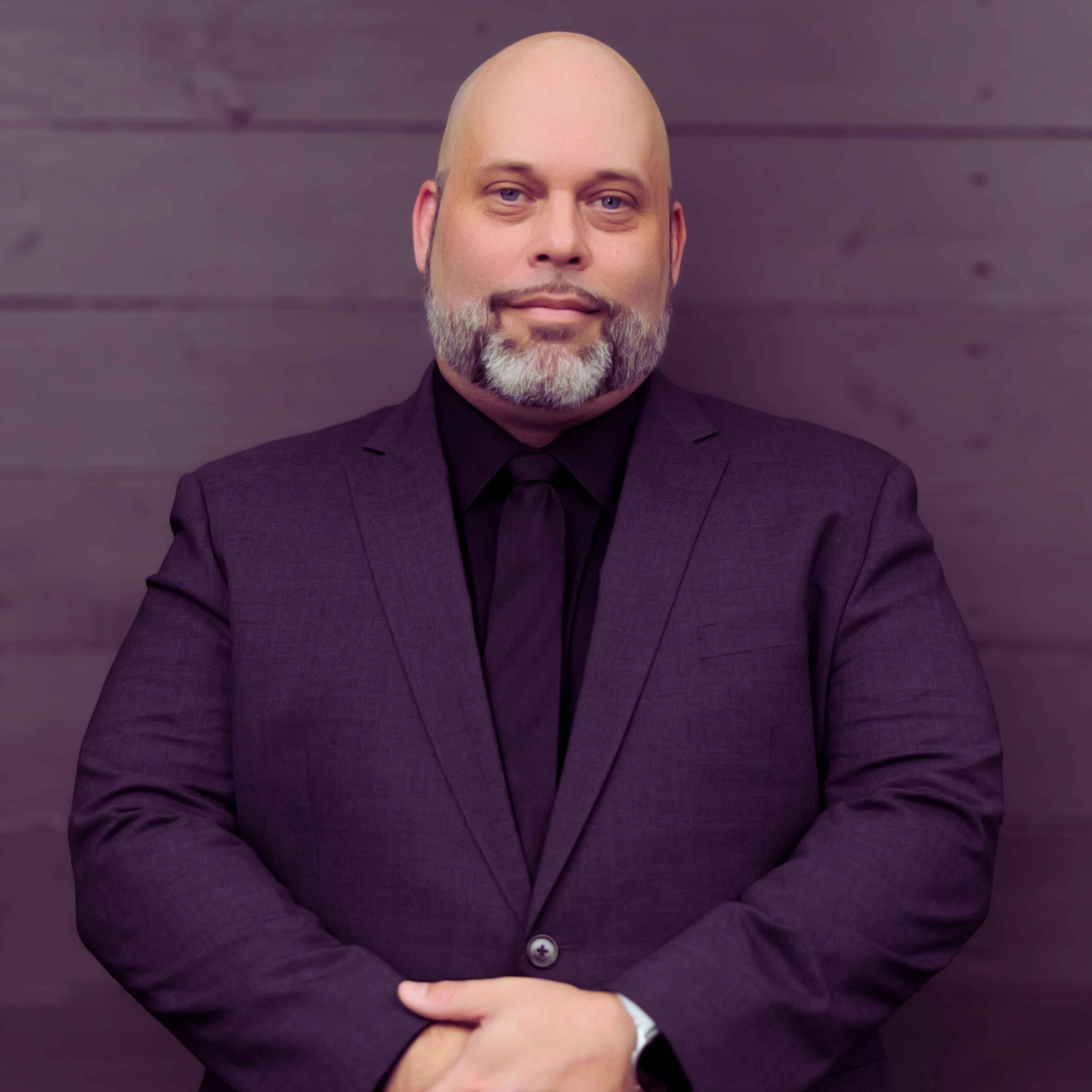 Chad Markham, President and CEO of Allegiant Digital Marketing, professional headshot on brand-aligned purple background